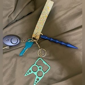 Blue glow in the dark self defense keychain